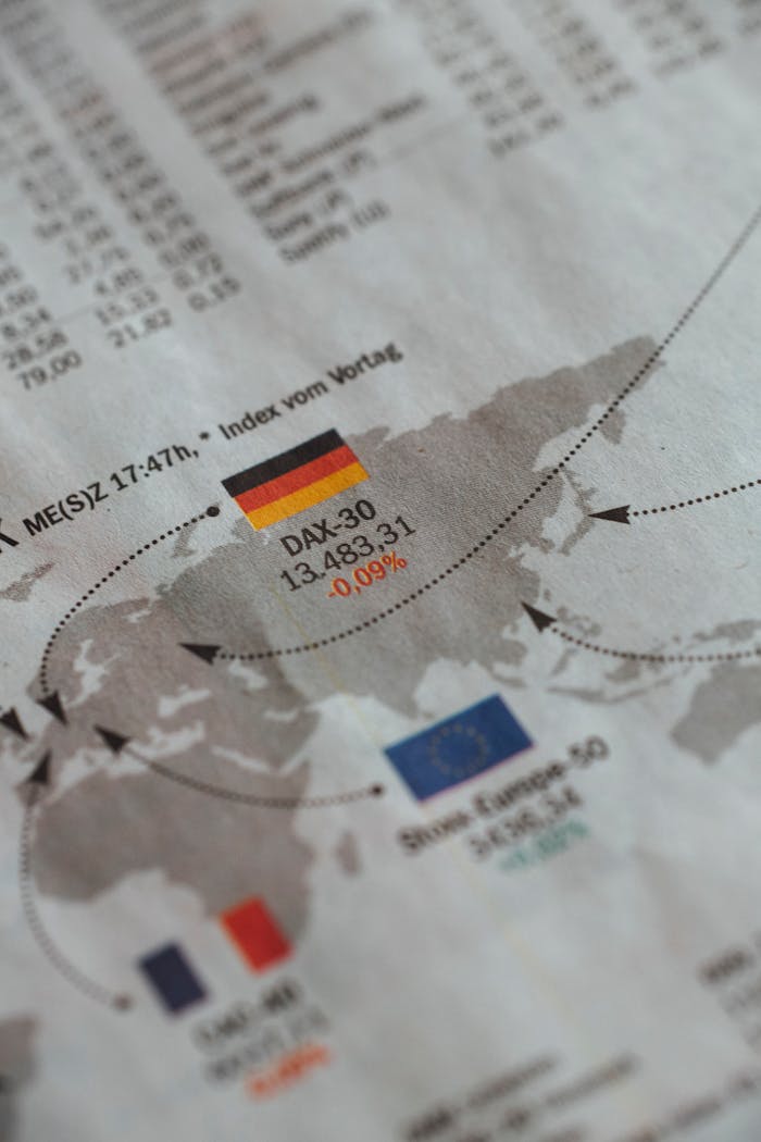 about-us From above of business newspaper with trading indexes and flags of Germany France and European Union